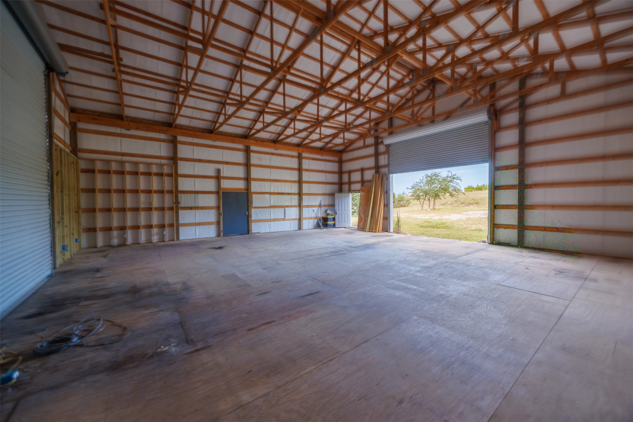 428 Summit Spring Lane Johnson City, TX 78636 - Photo 15 of 19 a view of empty room with a ceiling fan