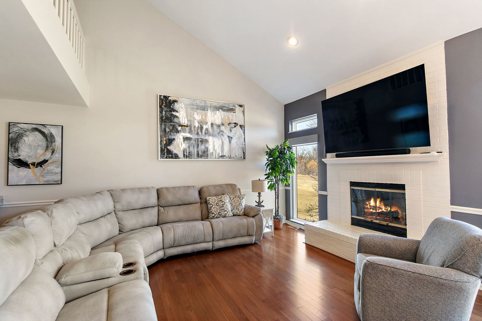 814 Oak Hill Road Lake Barrington, IL 60010 - Photo 14 of 59 a living room with furniture a flat screen tv and a fireplace