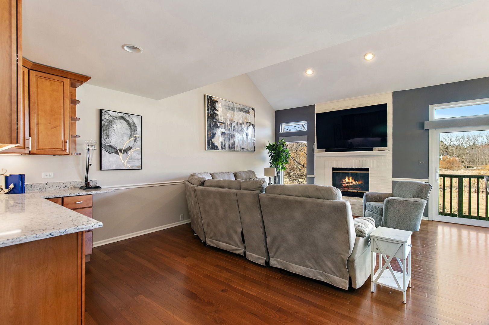 814 Oak Hill Road Lake Barrington, IL 60010 - Photo 17 of 59 a living room with furniture a flat screen tv and a fireplace