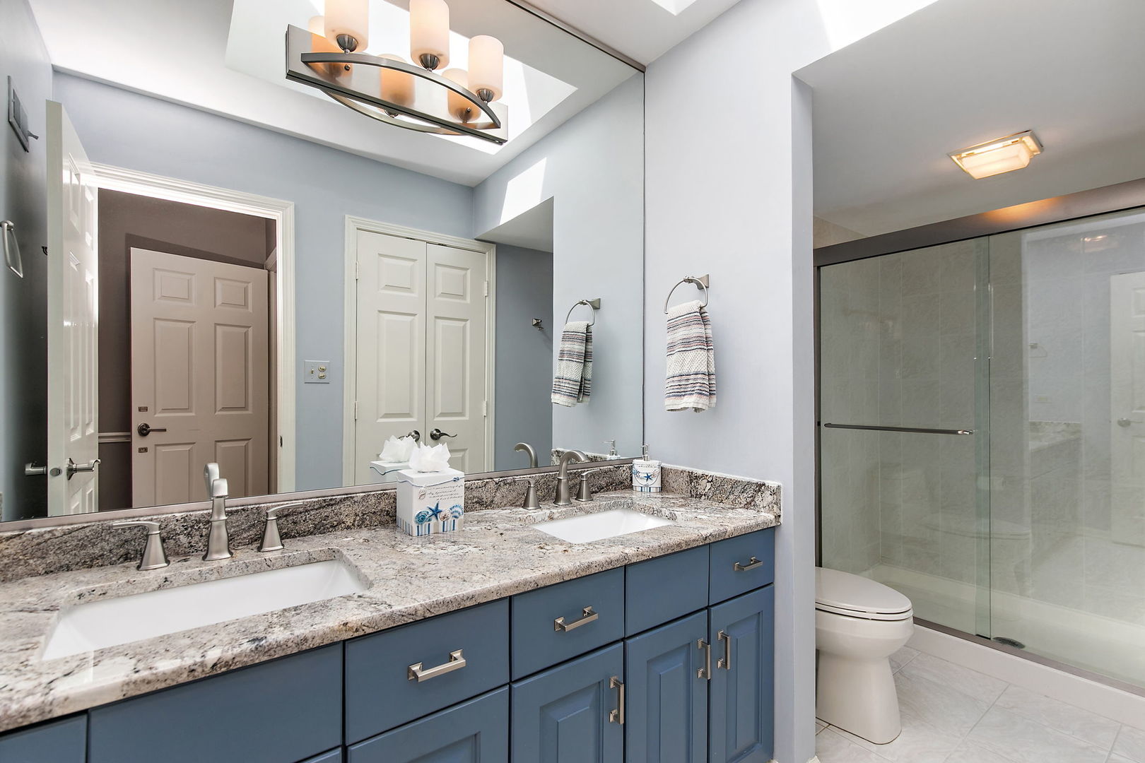 814 Oak Hill Road Lake Barrington, IL 60010 - Photo 21 of 59 a bathroom with a granite countertop toilet sink and mirror