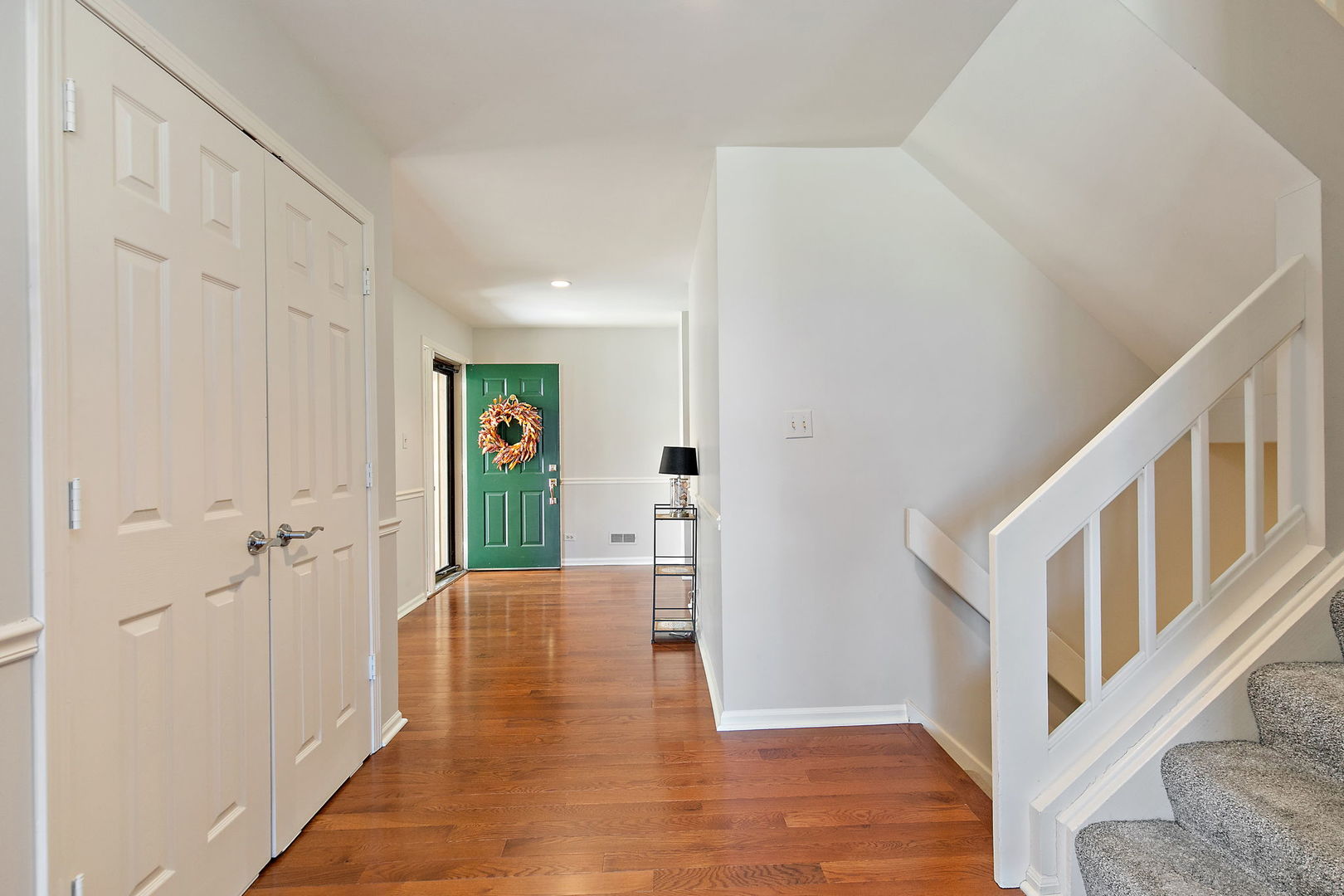 814 Oak Hill Road Lake Barrington, IL 60010 - Photo 3 of 59 a view of a hallway with wooden floor and staircase