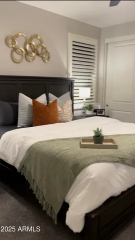 a bedroom with a bed and dresser