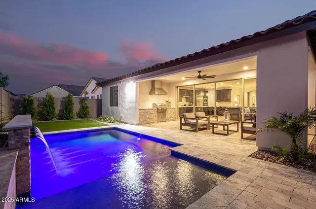 a view of swimming pool with outdoor seating