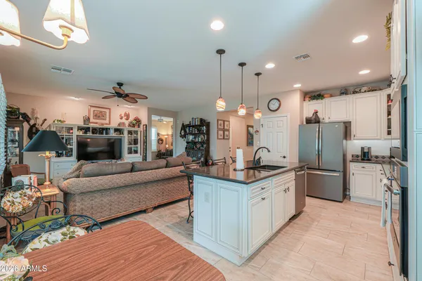 an aerial view of a house with a yard and lake view