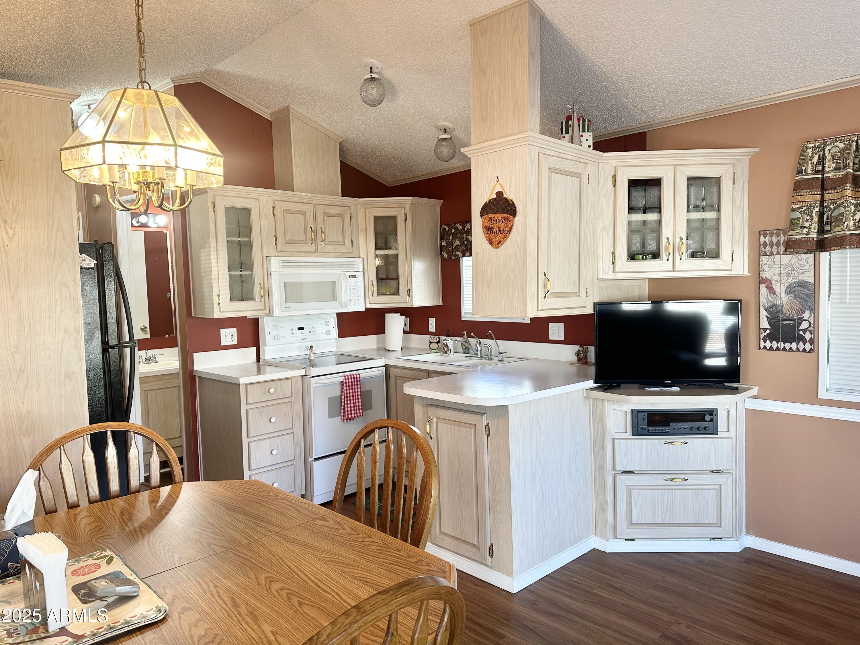 587 South Jasper Drive, Unit 587 Apache Junction, AZ 85119 - Photo 18 of 65 POPULAR U-SHAPED KITCHEN