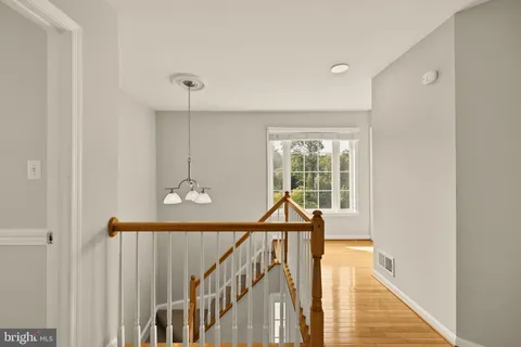 a view of balcony with wooden floor and outdoor seating
