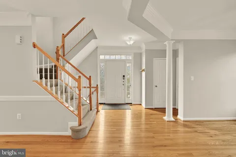 a view of an entryway with wooden floor