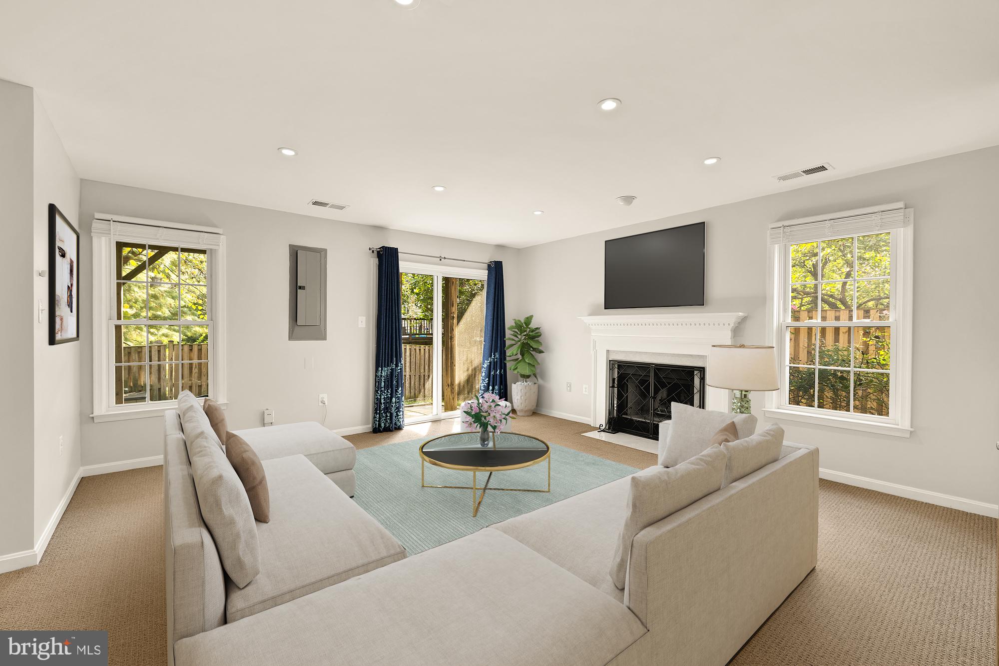 3015 Fallswood Glen Court Falls Church, VA 22044 - Photo 27 of 36 a living room with furniture fireplace and a large window