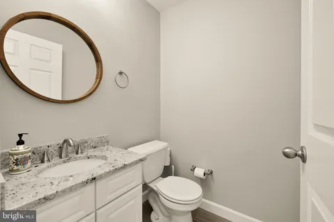 a view of an empty room with fireplace