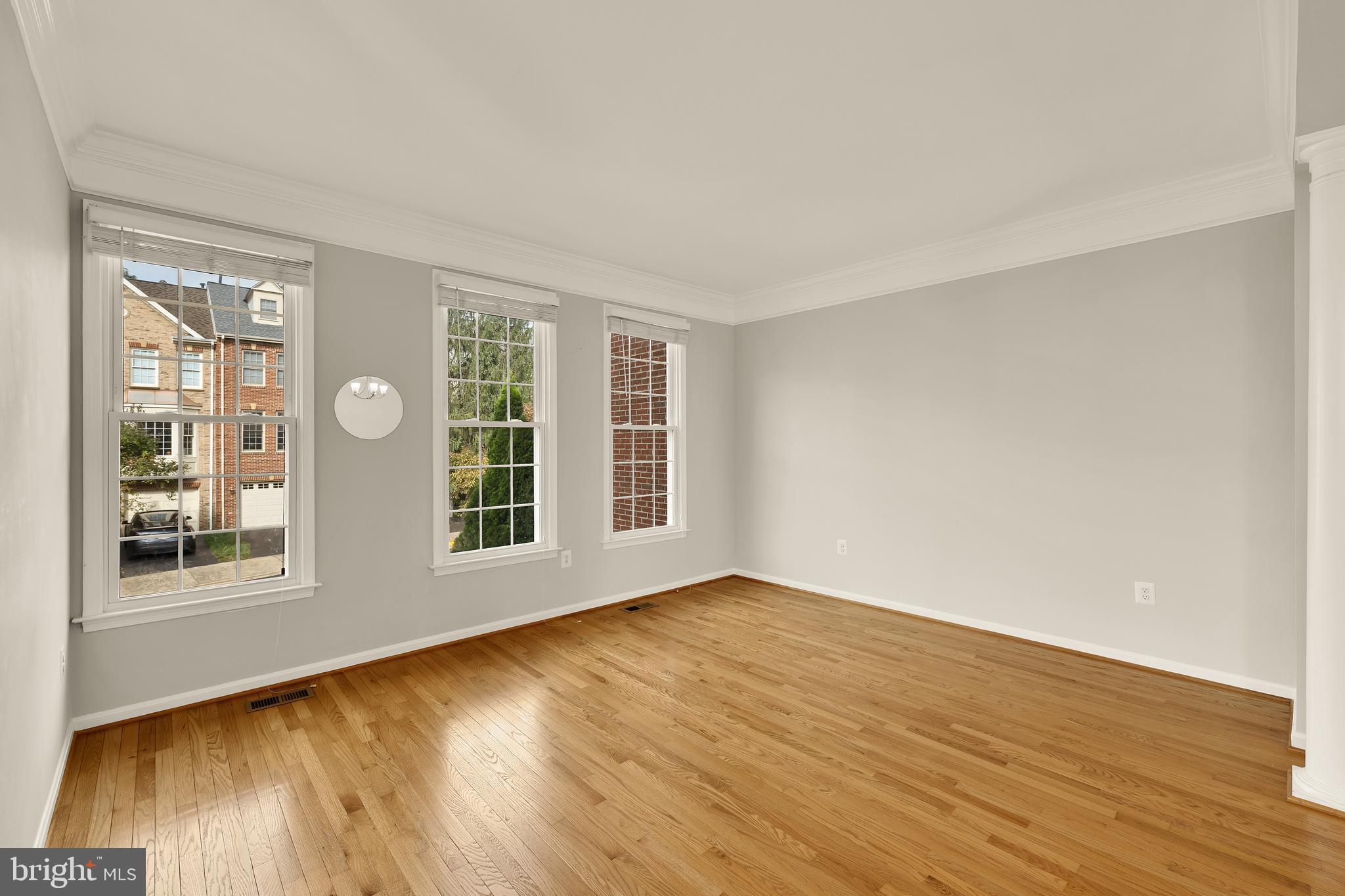 3015 Fallswood Glen Court Falls Church, VA 22044 - Photo 5 of 36 a view of an empty room with wooden floor and windows