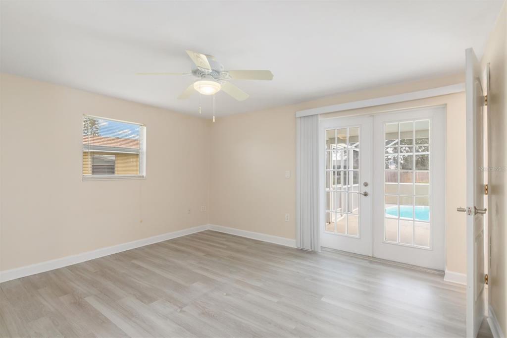 703 Spring Lake Boulevard Northwest Port Charlotte, FL 33952 - Photo 12 of 36 a view of an empty room with a window