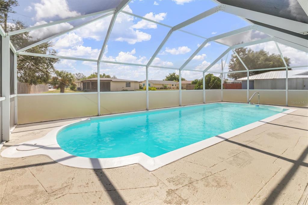 703 Spring Lake Boulevard Northwest Port Charlotte, FL 33952 - Photo 23 of 36 a view of a backyard