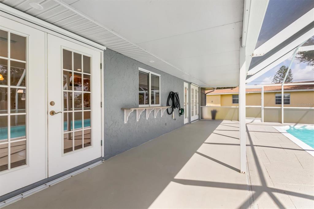 703 Spring Lake Boulevard Northwest Port Charlotte, FL 33952 - Photo 26 of 36 a front view of a building with a porch