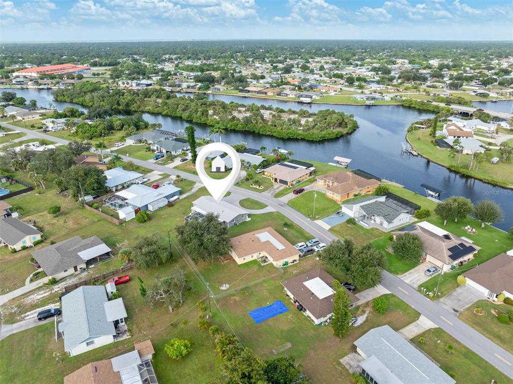 703 Spring Lake Boulevard Northwest Port Charlotte, FL 33952 - Photo 33 of 36 an aerial view of a city