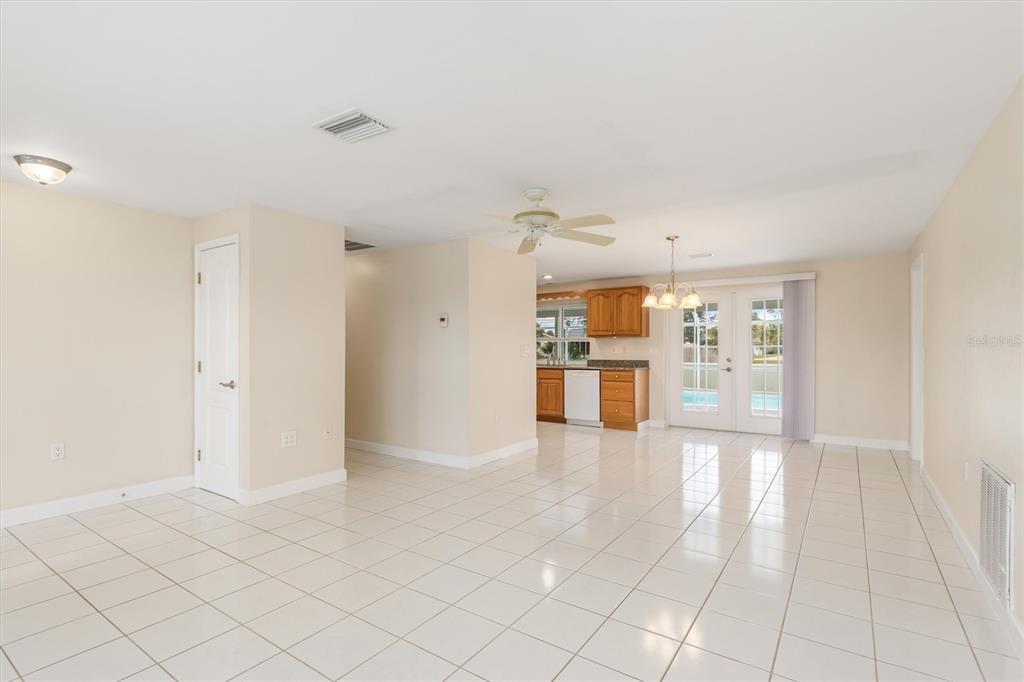 703 Spring Lake Boulevard Northwest Port Charlotte, FL 33952 - Photo 5 of 36 a view of a kitchen with furniture and an empty room