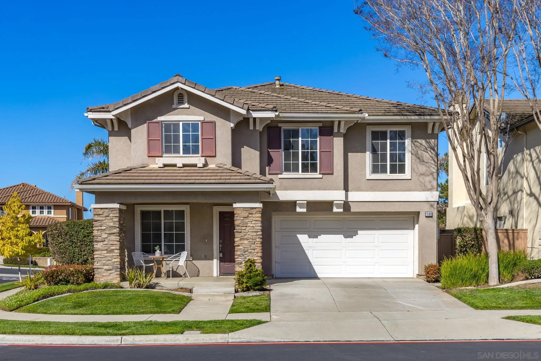 1589 Laurel Circle Vista, CA 92081 - Photo 1 of 31 a front view of a house with a yard table and chairs