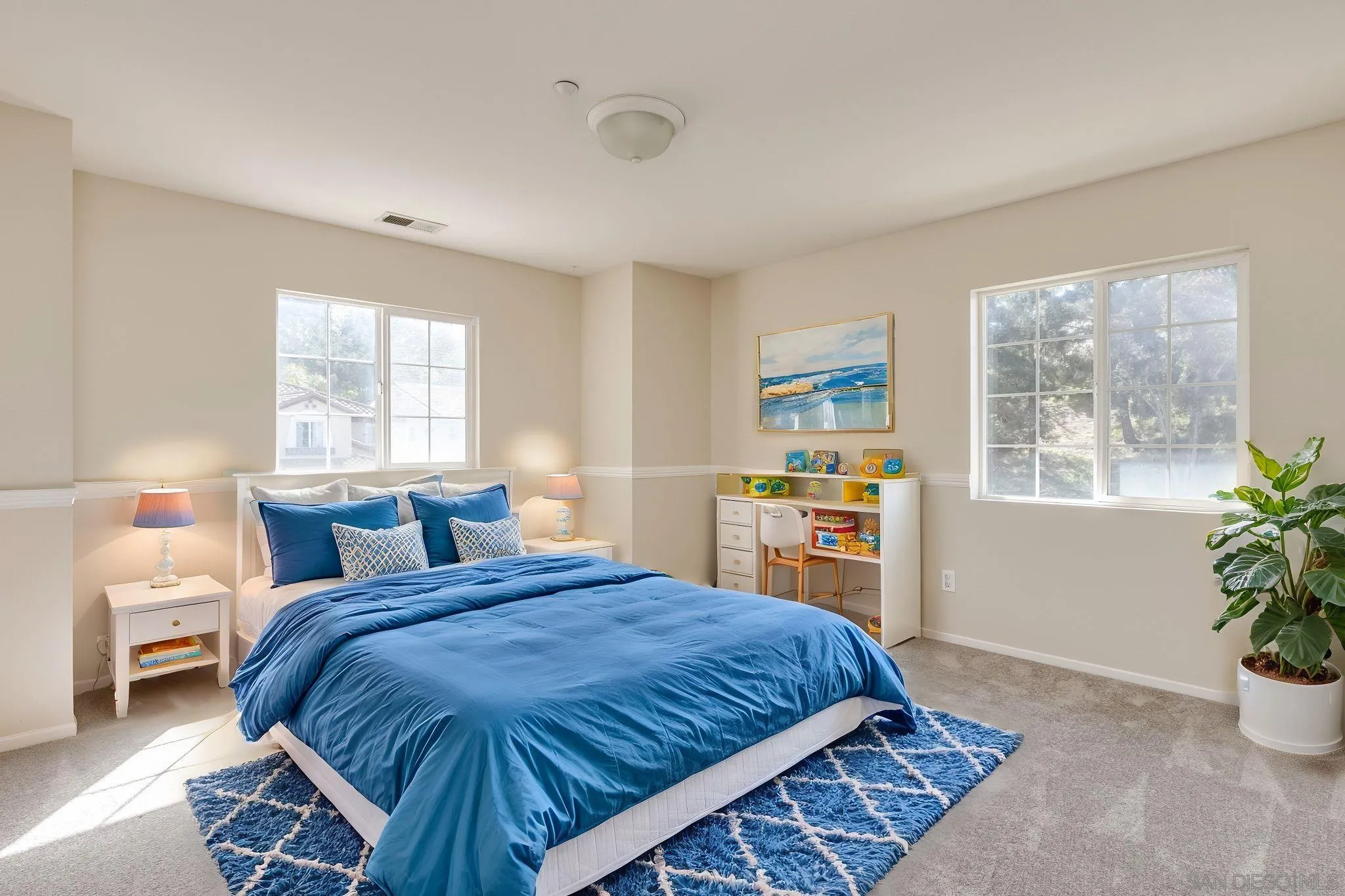 1589 Laurel Circle Vista, CA 92081 - Photo 19 of 31 a bedroom with a large bed and a window