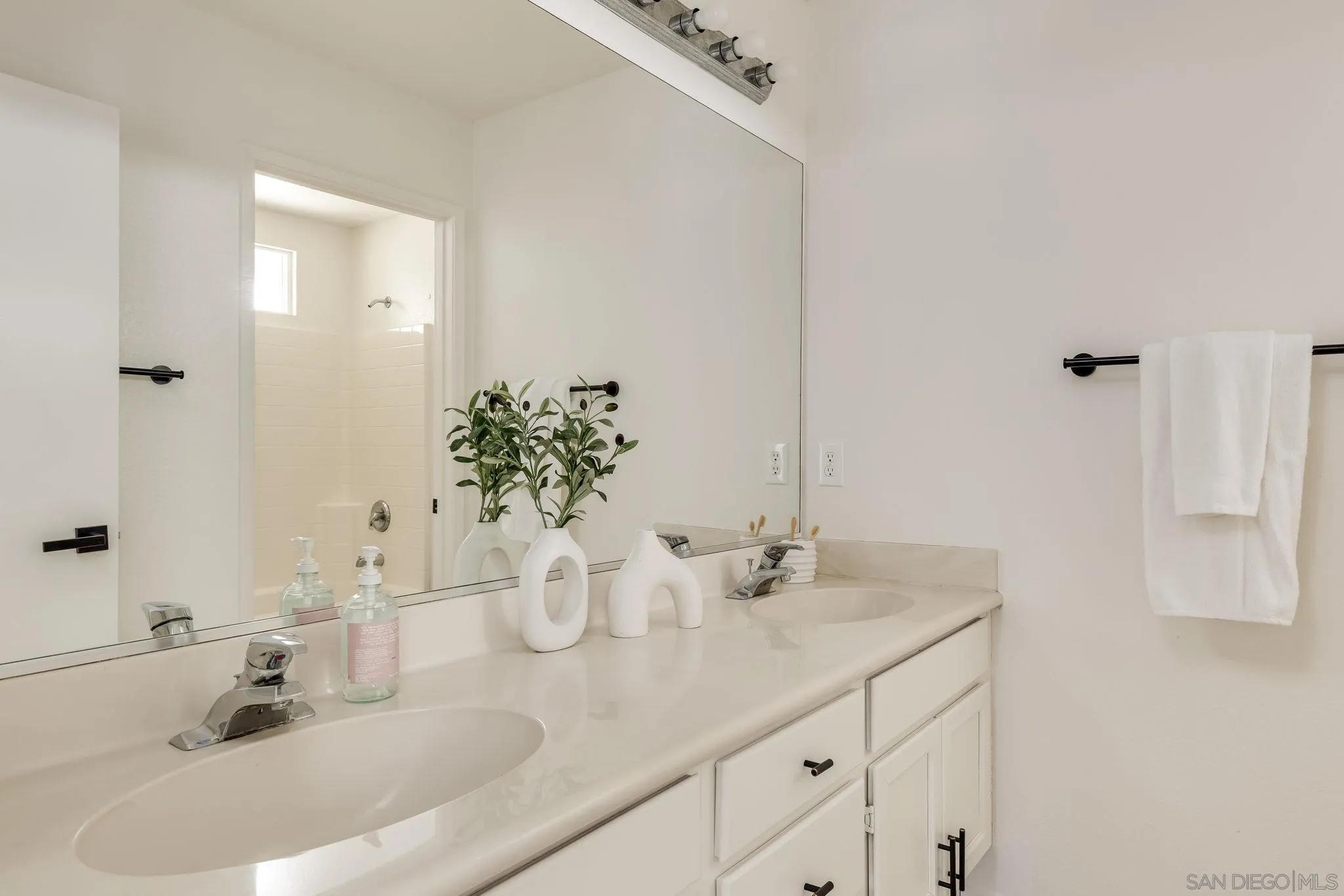 1589 Laurel Circle Vista, CA 92081 - Photo 20 of 31 a bathroom with a sink and a mirror