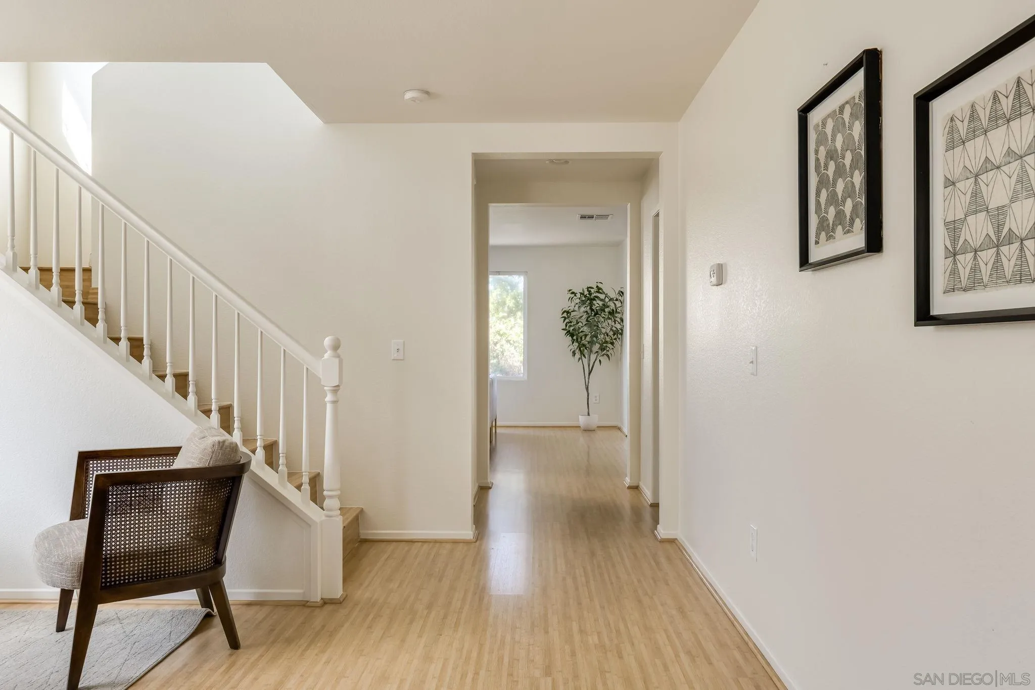 1589 Laurel Circle Vista, CA 92081 - Photo 3 of 31 a view of a hallway with wooden floor and entryway