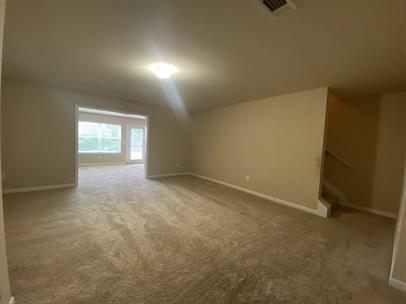 3829 Baxley Ridge Drive Suwanee, GA 30024 - Photo 9 of 11 an empty room with windows