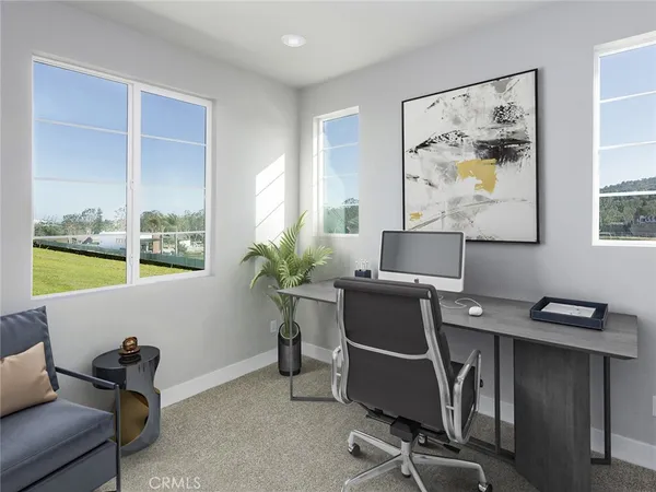 a workspace with furniture and window