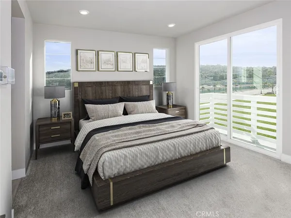 a spacious bedroom with a bed and a large window