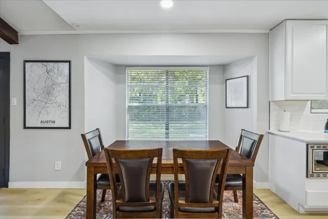 a view of a dining room with furniture window and outside view