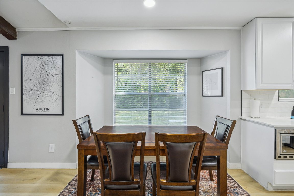 10414 Quail Ridge Drive Austin, TX 78758 - Photo 14 of 17 a view of a dining room with furniture window and outside view