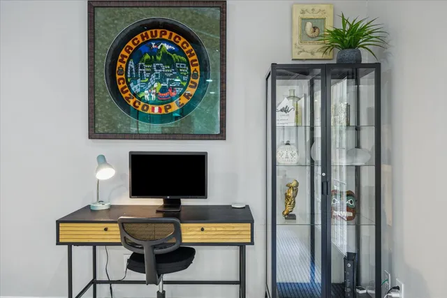 a view of a workspace with furniture