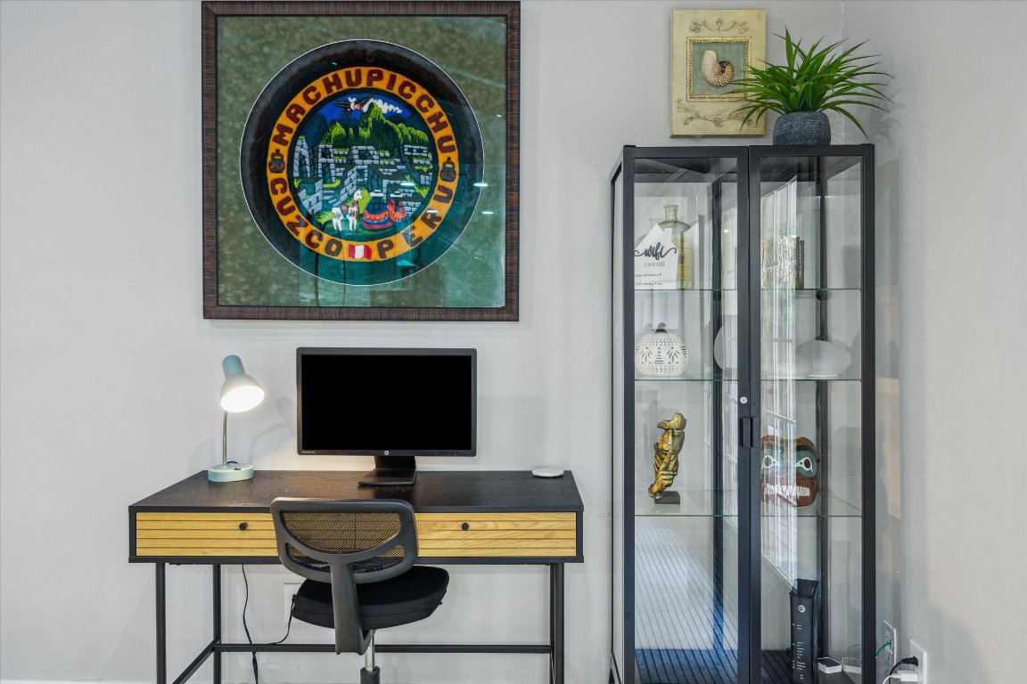 10414 Quail Ridge Drive Austin, TX 78758 - Photo 17 of 17 a view of a workspace with furniture