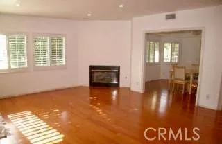 a view of livingroom with furniture wooden floor and windows