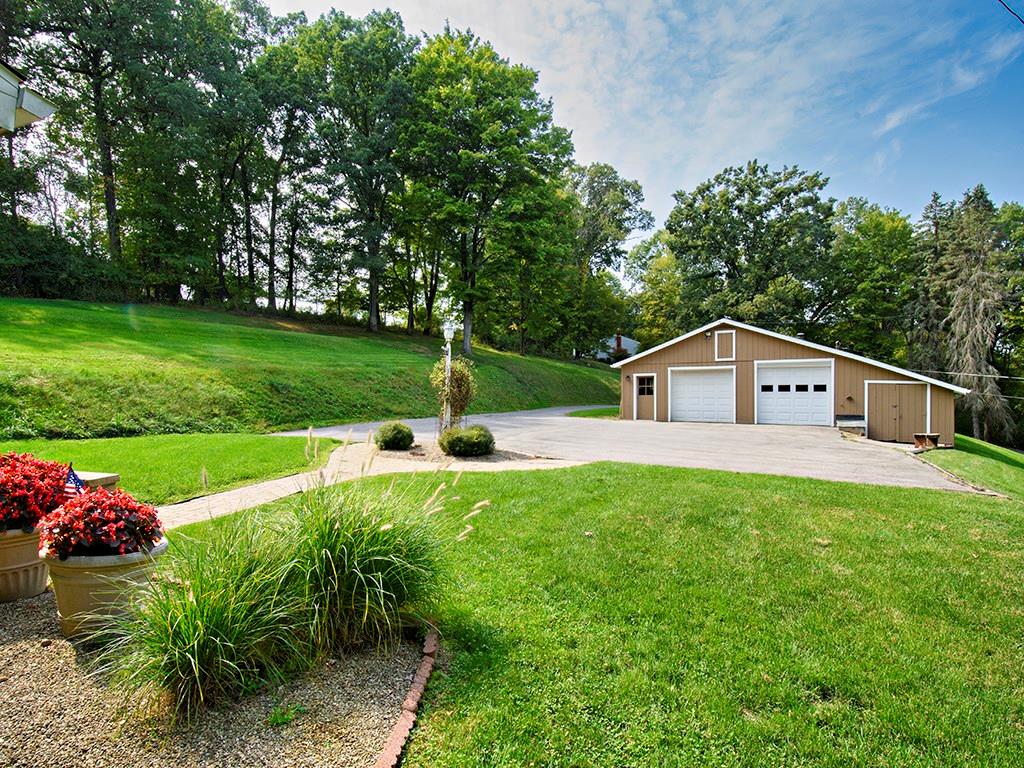 413 Spring St Extension Mars, PA 16046 - Photo 6 of 22 View From House, Looking on to the Garage and Driveway. THE GARAGE, It's HUGE. There is Water, Electric, Storage Upstairs and an Extra Bay to store your Toys. A little more than a Man Cave going on here.