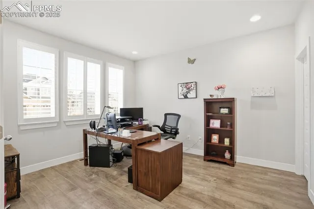 a room with furniture a desk and a window
