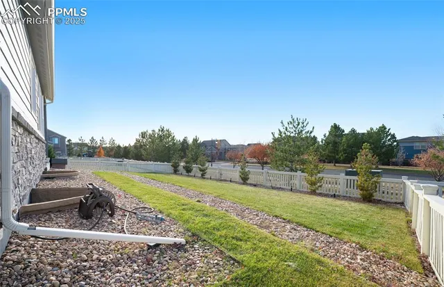 a view of a yard with swimming pool