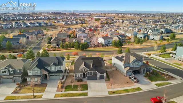 an aerial view of residential houses with outdoor space