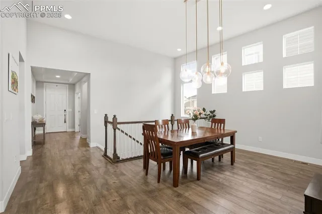 a view of a dining room with furniture and window