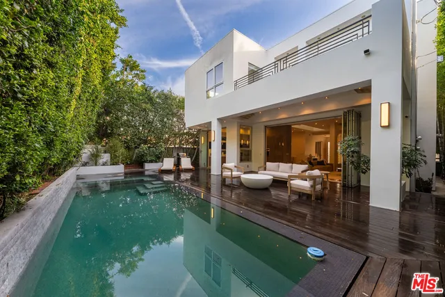 a living room with patio furniture