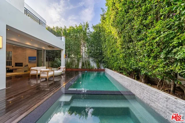 a view of swimming pool with chairs