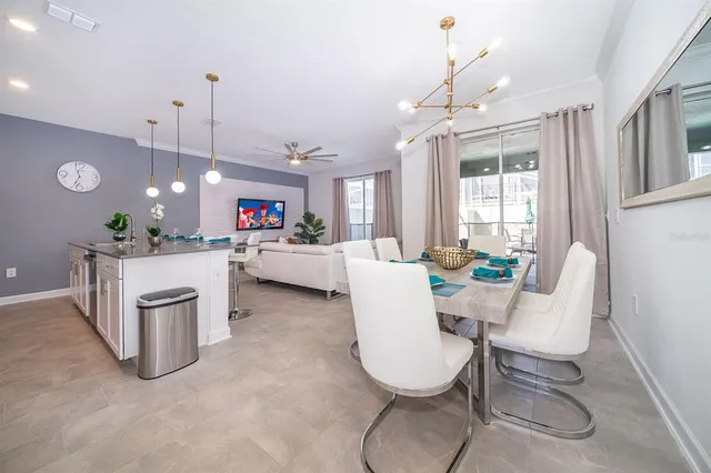 a living room with furniture a dining table and chairs