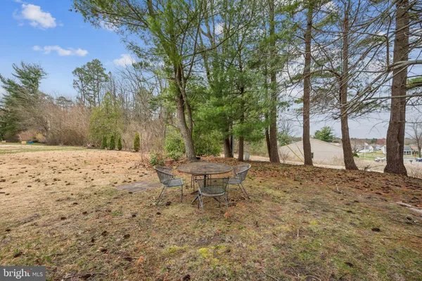 a view of a backyard of the house