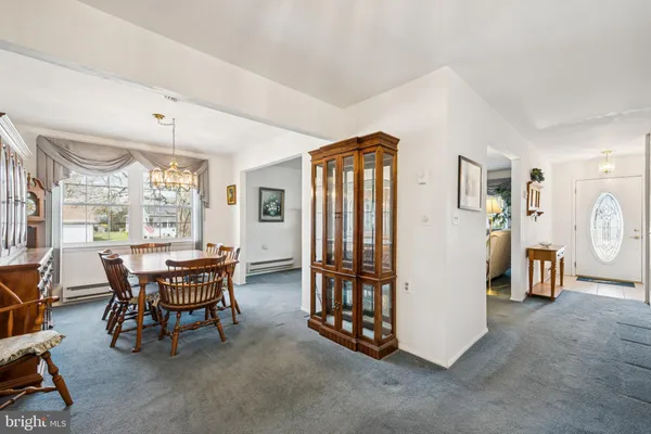 a dining room with furniture and window