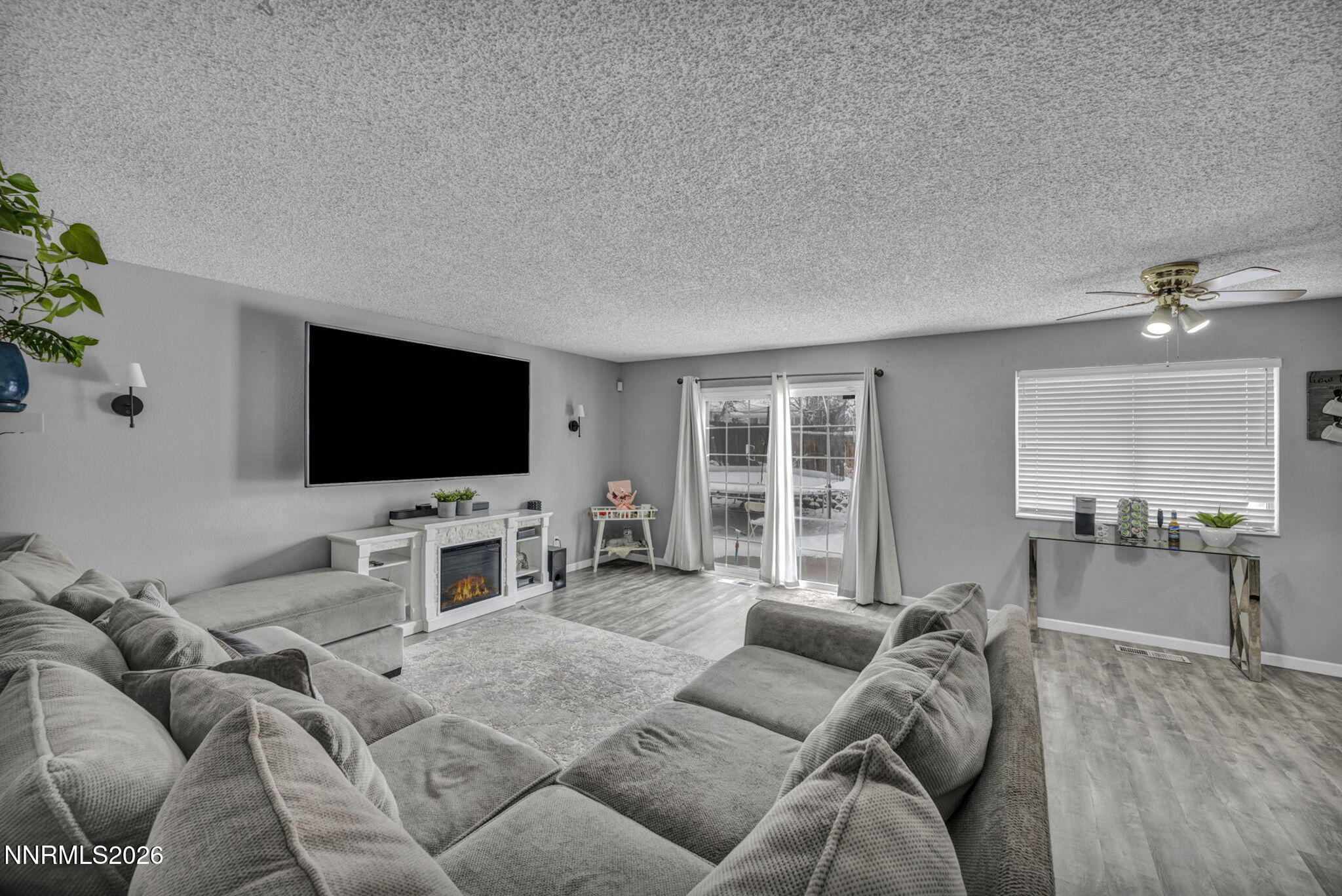 8655 Silver Shores Drive Reno, NV 89506 - Photo 18 of 42 a living room with furniture and a flat screen tv