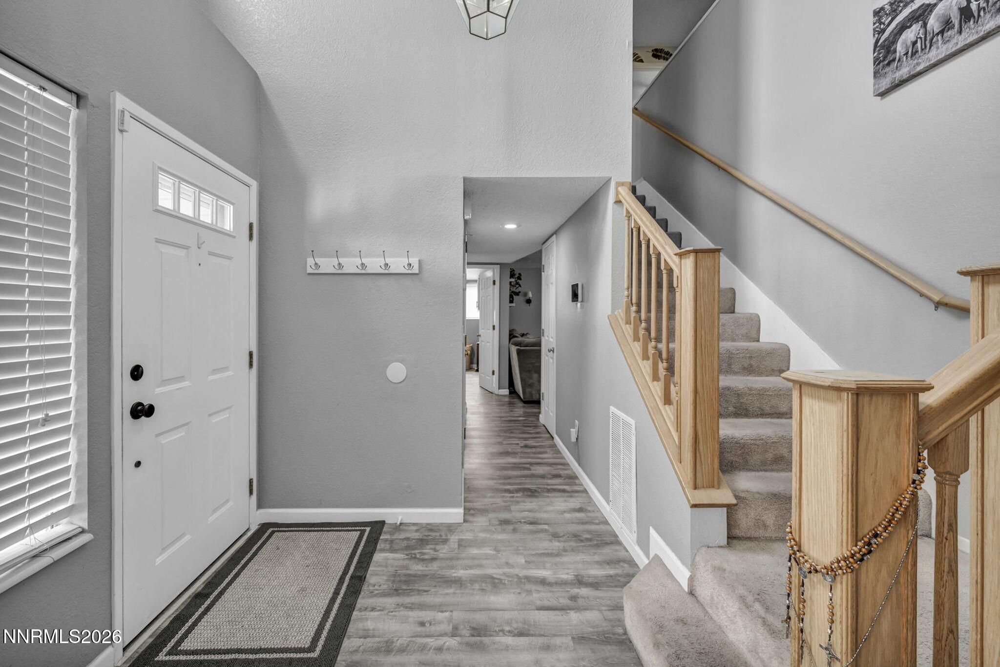 8655 Silver Shores Drive Reno, NV 89506 - Photo 20 of 42 a view of a hallway with wooden floor and staircase