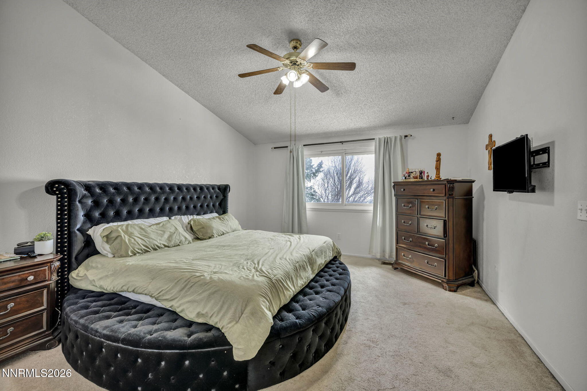 8655 Silver Shores Drive Reno, NV 89506 - Photo 22 of 42 a bedroom with a bed and dresser with mirror