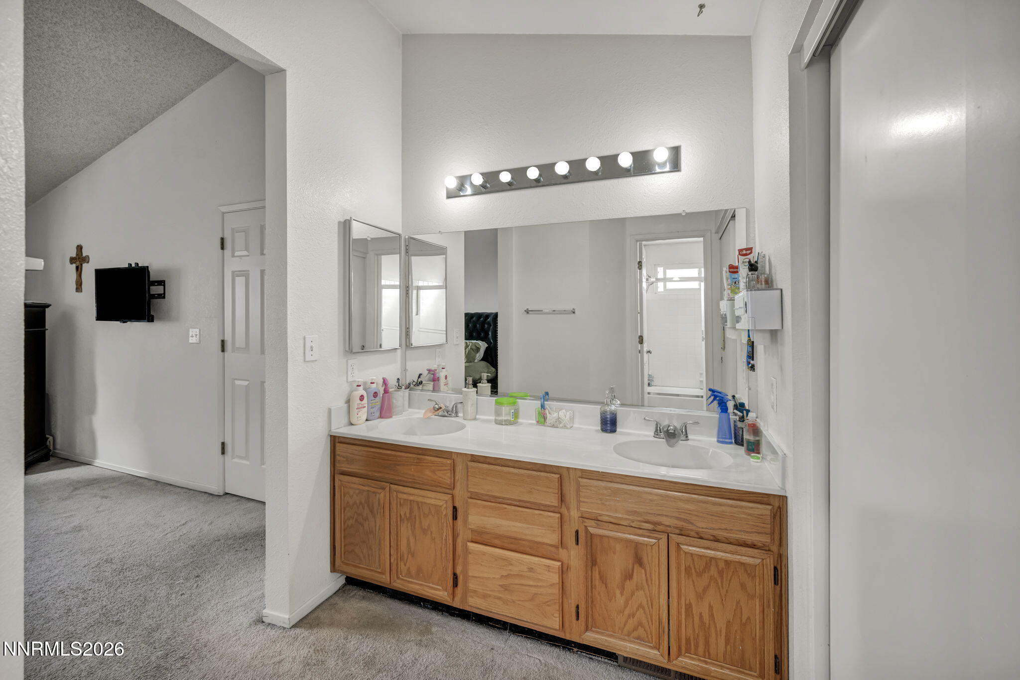 8655 Silver Shores Drive Reno, NV 89506 - Photo 24 of 42 a spacious bathroom with a double vanity sink a mirror and shower
