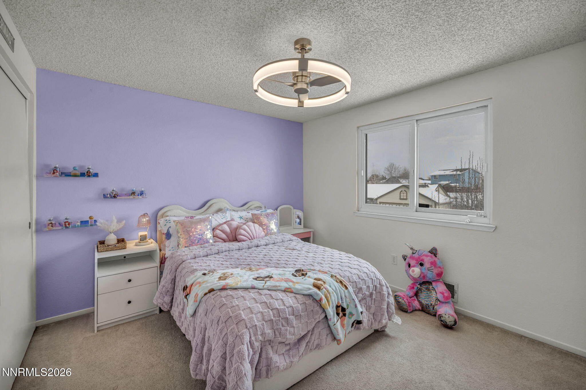 8655 Silver Shores Drive Reno, NV 89506 - Photo 29 of 42 a bedroom with a bed and a chandelier