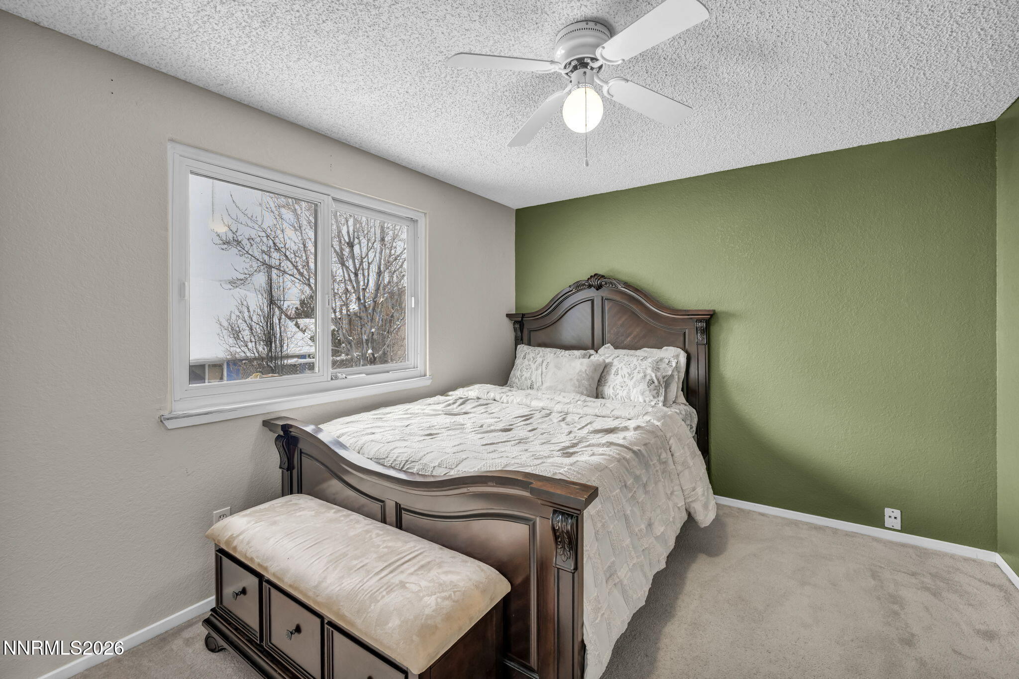 8655 Silver Shores Drive Reno, NV 89506 - Photo 31 of 42 a bedroom with a bed and a chandelier