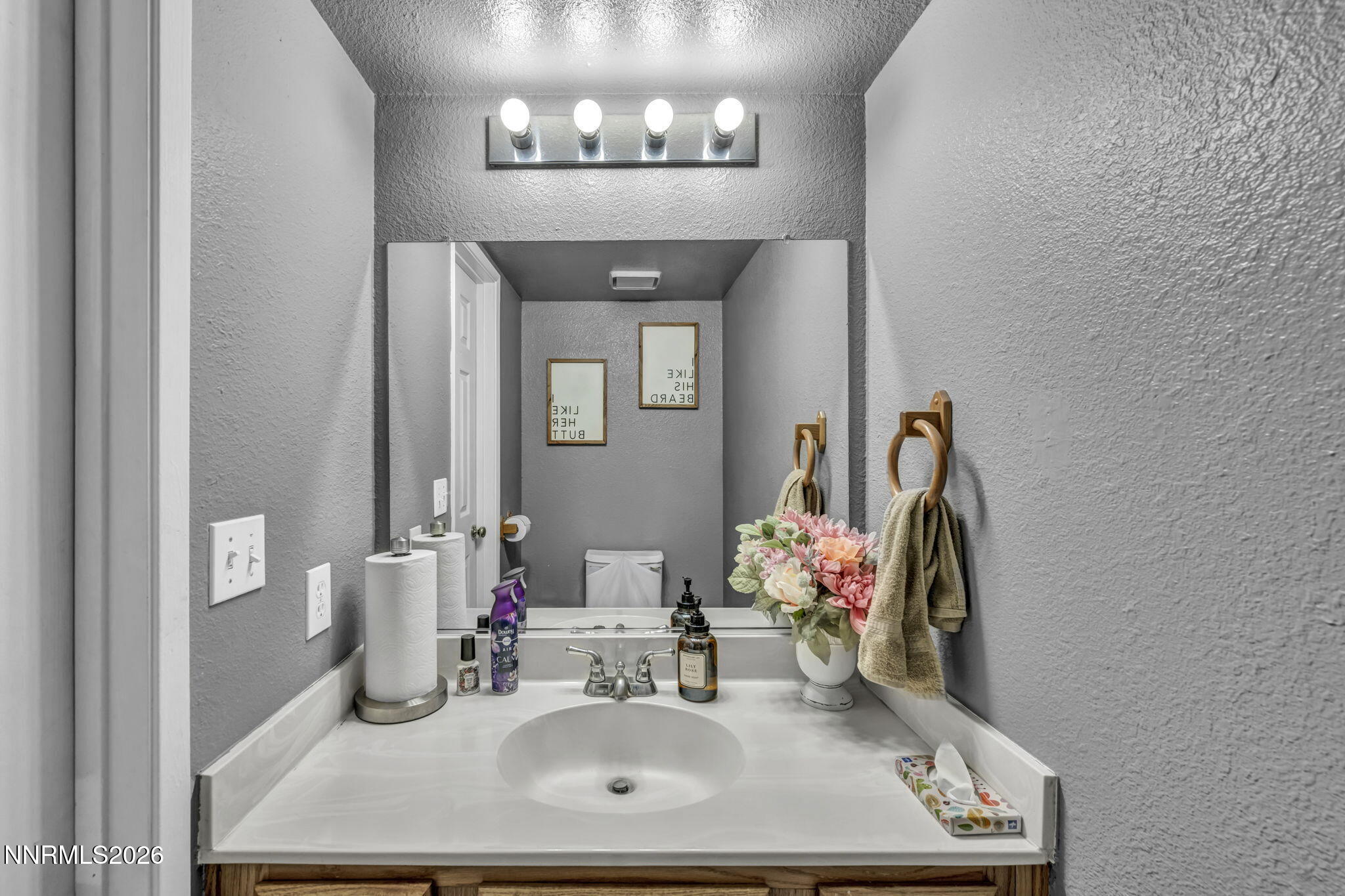 8655 Silver Shores Drive Reno, NV 89506 - Photo 33 of 42 a bathroom with a sink mirror and vanity