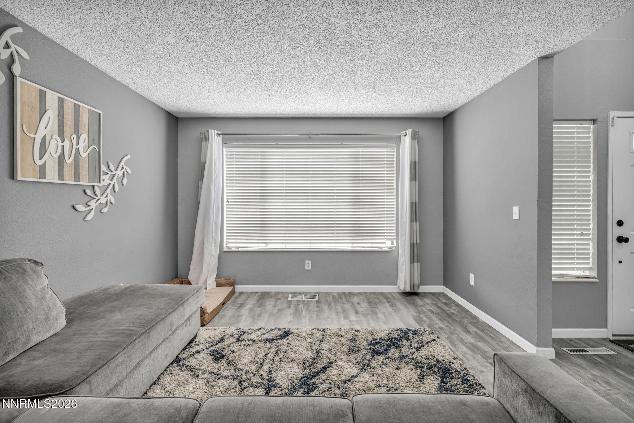 8655 Silver Shores Drive Reno, NV 89506 - Photo 4 of 42 a view of a bedroom with furniture and windows