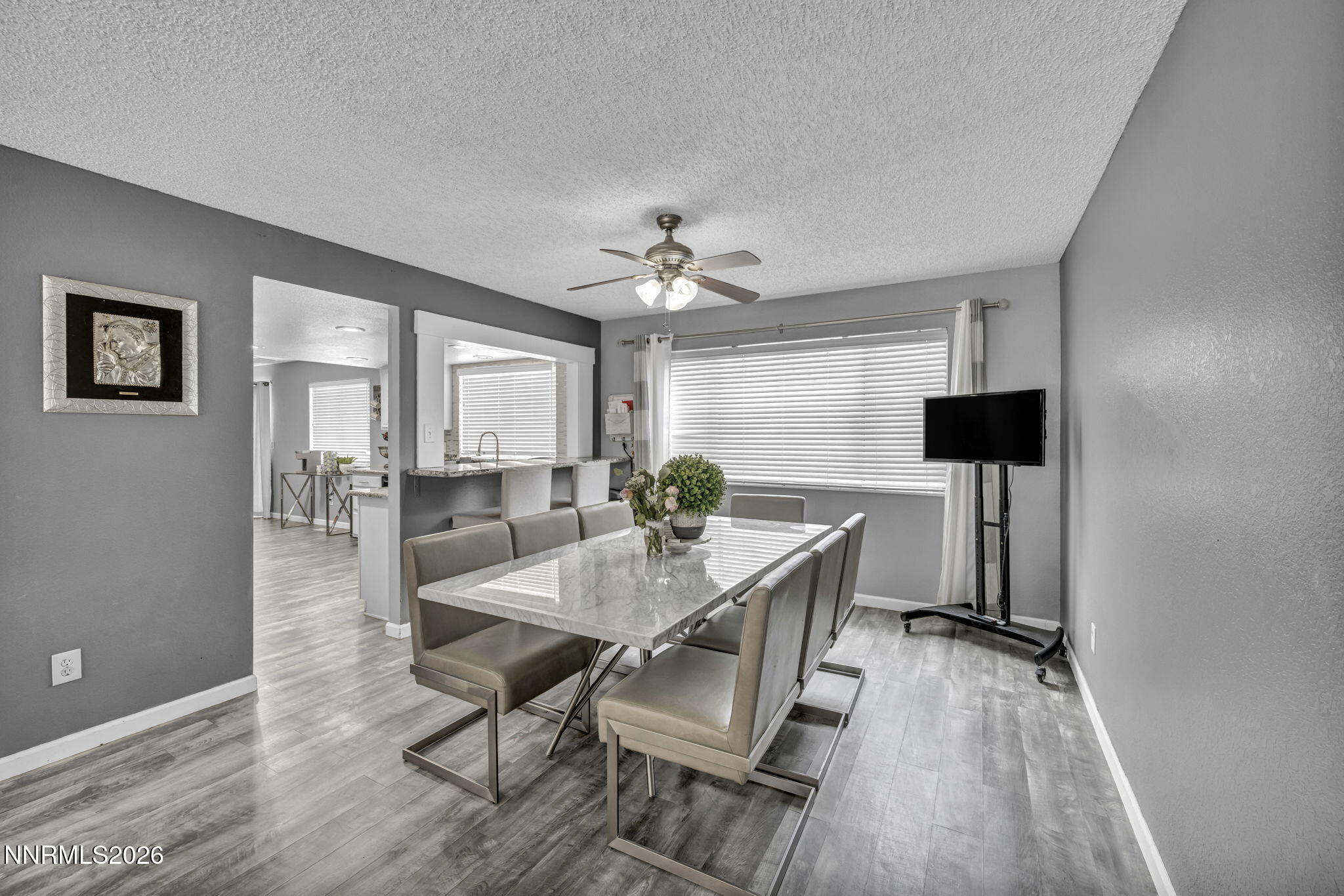 8655 Silver Shores Drive Reno, NV 89506 - Photo 8 of 42 a view of a dining room with furniture and wooden floor